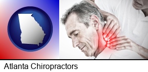 Atlanta, Georgia - male chiropractor massaging the neck of a patient