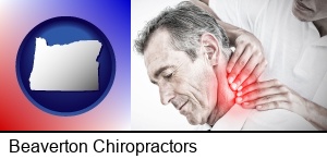 Beaverton, Oregon - male chiropractor massaging the neck of a patient