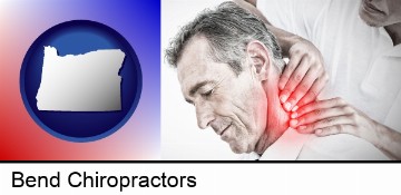 male chiropractor massaging the neck of a patient in Bend, OR