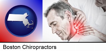 male chiropractor massaging the neck of a patient in Boston, MA