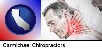 male chiropractor massaging the neck of a patient in Carmichael, CA