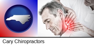 Cary, North Carolina - male chiropractor massaging the neck of a patient