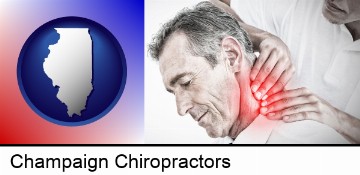 male chiropractor massaging the neck of a patient in Champaign, IL