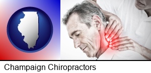 Champaign, Illinois - male chiropractor massaging the neck of a patient