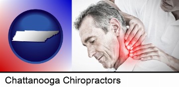 male chiropractor massaging the neck of a patient in Chattanooga, TN