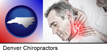 male chiropractor massaging the neck of a patient in Denver, NC