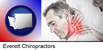 male chiropractor massaging the neck of a patient in Everett, WA