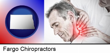 male chiropractor massaging the neck of a patient in Fargo, ND