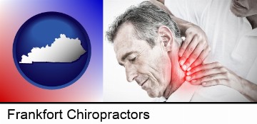 male chiropractor massaging the neck of a patient in Frankfort, KY