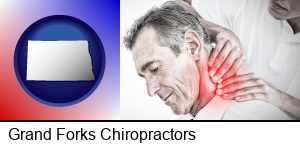 Grand Forks, North Dakota - male chiropractor massaging the neck of a patient