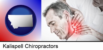 male chiropractor massaging the neck of a patient in Kalispell, MT