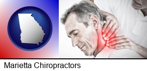 Marietta, Georgia - male chiropractor massaging the neck of a patient