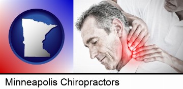 male chiropractor massaging the neck of a patient in Minneapolis, MN