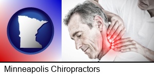 Minneapolis, Minnesota - male chiropractor massaging the neck of a patient