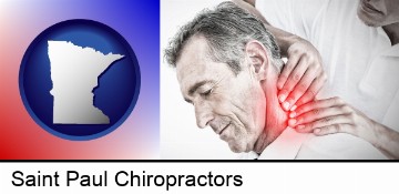 male chiropractor massaging the neck of a patient in Saint Paul, MN