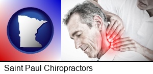 Saint Paul, Minnesota - male chiropractor massaging the neck of a patient