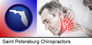 male chiropractor massaging the neck of a patient in Saint Petersburg, FL