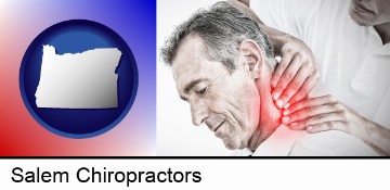 male chiropractor massaging the neck of a patient in Salem, OR