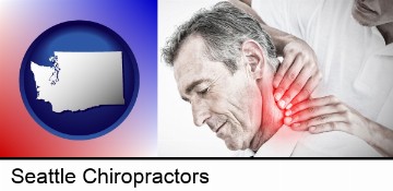 male chiropractor massaging the neck of a patient in Seattle, WA