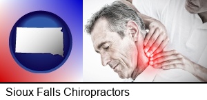 Sioux Falls, South Dakota - male chiropractor massaging the neck of a patient
