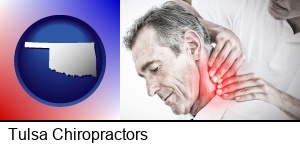 Tulsa, Oklahoma - male chiropractor massaging the neck of a patient