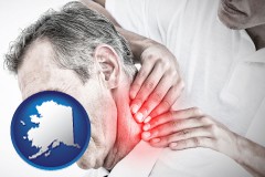 alaska map icon and male chiropractor massaging the neck of a patient
