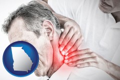 georgia map icon and male chiropractor massaging the neck of a patient