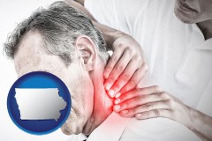 iowa map icon and male chiropractor massaging the neck of a patient