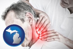 michigan map icon and male chiropractor massaging the neck of a patient