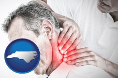 north-carolina map icon and male chiropractor massaging the neck of a patient