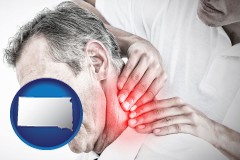 south-dakota map icon and male chiropractor massaging the neck of a patient