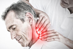 male chiropractor massaging the neck of a patient