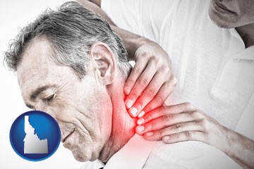 male chiropractor massaging the neck of a patient - with Idaho icon
