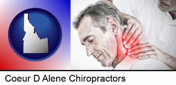male chiropractor massaging the neck of a patient in Coeur D Alene, ID