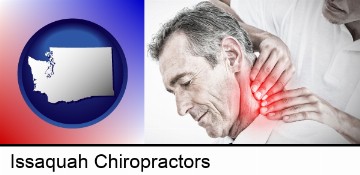 male chiropractor massaging the neck of a patient in Issaquah, WA
