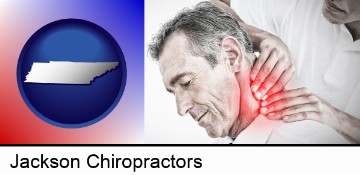 male chiropractor massaging the neck of a patient in Jackson, TN
