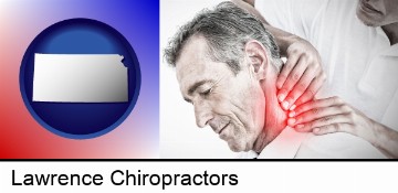 male chiropractor massaging the neck of a patient in Lawrence, KS