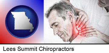 male chiropractor massaging the neck of a patient in Lees Summit, MO