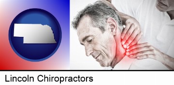 male chiropractor massaging the neck of a patient in Lincoln, NE