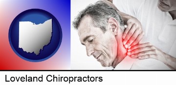 male chiropractor massaging the neck of a patient in Loveland, OH