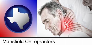 male chiropractor massaging the neck of a patient in Mansfield, TX