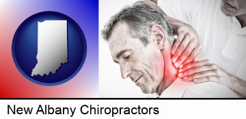 male chiropractor massaging the neck of a patient in New Albany, IN
