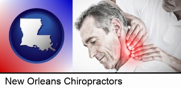 male chiropractor massaging the neck of a patient in New Orleans, LA