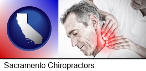 Sacramento, California - male chiropractor massaging the neck of a patient