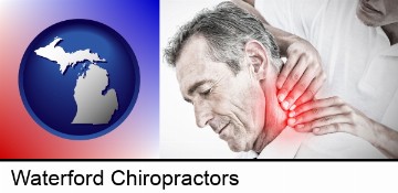 male chiropractor massaging the neck of a patient in Waterford, MI