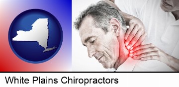 male chiropractor massaging the neck of a patient in White Plains, NY
