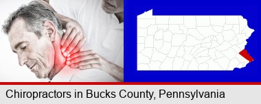 male chiropractor massaging the neck of a patient; Bucks County highlighted in red on a map